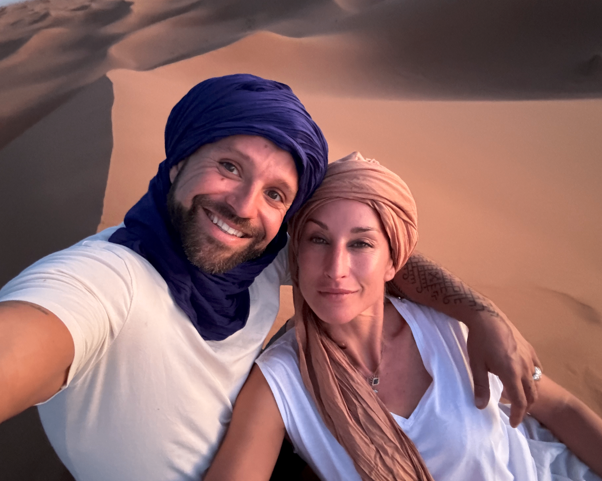 Emmanuel and Melissa walking in the desert